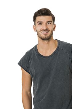 Handsome bearded young man with a lovely charismatic smile wearing a cotton t-shirt, isolated on white