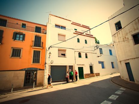 Spain, Tossa de Mar,  JUNE 15, 2013: sunny evening on Carrer la Guardia street in Mediterranean town. instagram image retro style