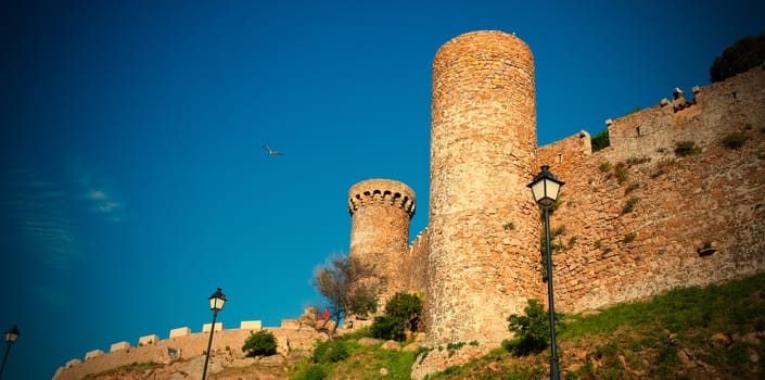 Tossa de Mar, Costa Brava, Catalonia, Spain, JUNE 15, 2013: Watchtower of the medieval fortress Vila Vella, sightseeing tours. instagram image retro style