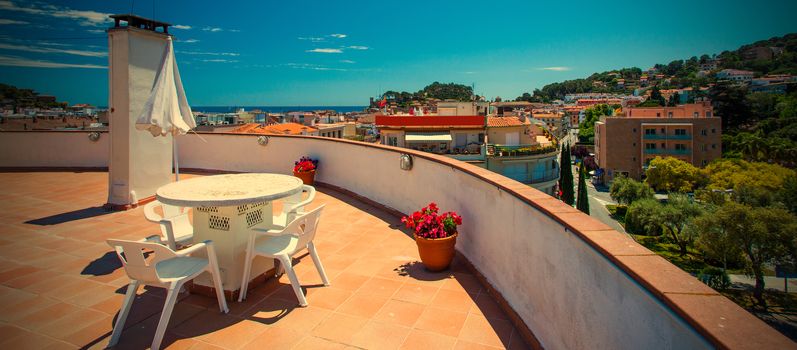 solarium on the roof of the hotel overlooking the town of Tossa de Mar, Spain. instagram image retro style