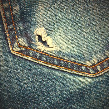 jeans pocket with hole, close up. instagram image style