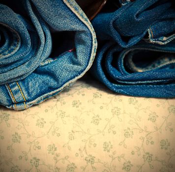 folded blue jeans with copy space. instagram image style