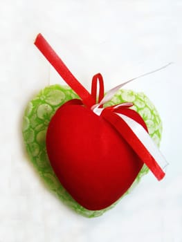 Green and red valentine heart isolated on the white background