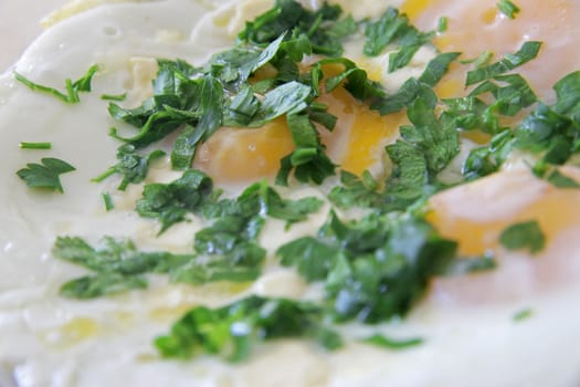 Fried eggs on the plate close up