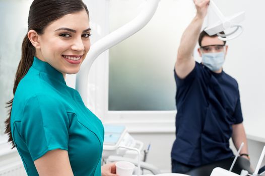 Female dental assistant smiling at the camera