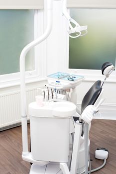 Modern dental clinic interior with dental chair 