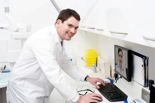 Dental expert talking to his assistant, online
