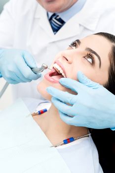 Female patient open her mouth during treatment