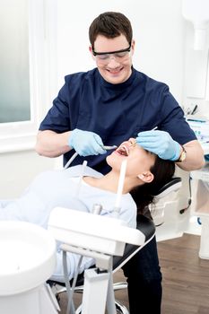 Female patient with dentist in a dental treatment