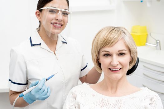Female patient posing with dental doctor