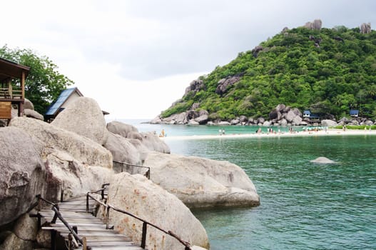 View of Koh Nanguan, Thailand,huge stones boulders and plank bridge