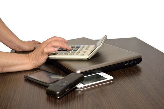 Close-up of business people hands while working calculator