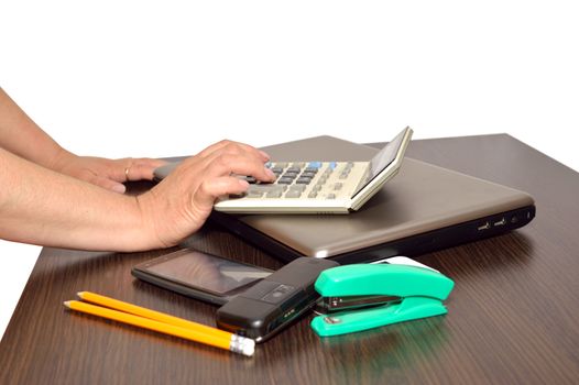 Close-up of business people hands while working calculator