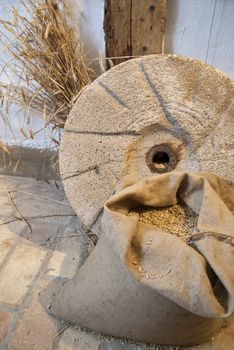 Old Mill Stone with Grain