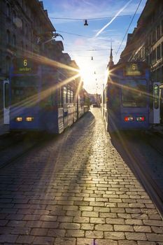 View of Bern street with tramway at sunset.