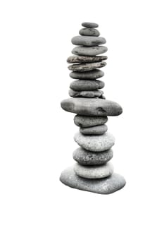 stones balancing on top of each to make a tower on a beach