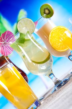 Alcohol drinks, beach background, natural colorful tone