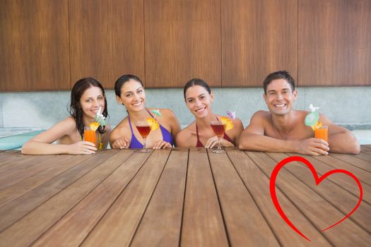 Cheerful people with drinks in swimming pool against heart