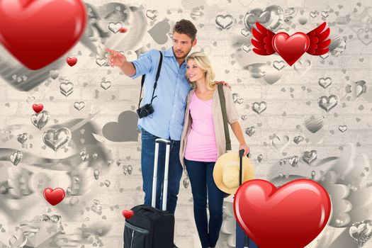 Attractive young couple ready to go on vacation against grey valentines heart pattern
