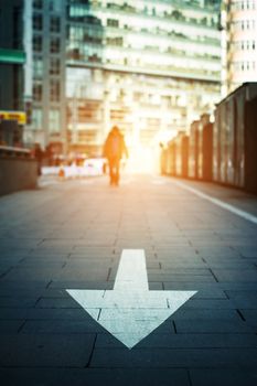 arrow on the road when sunset