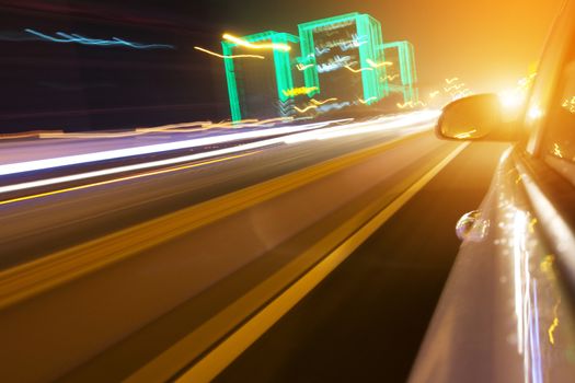 driving car in the night, view from side of car,blurred motion