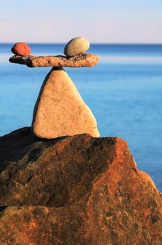 Symbol of scales on the top of boulder