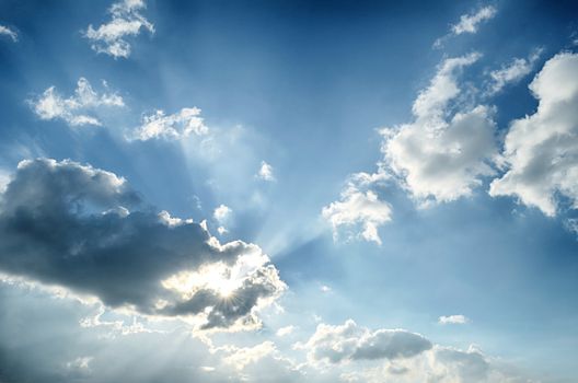 Blue sky with white cloud and sun