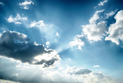 Blue sky with white cloud and sun