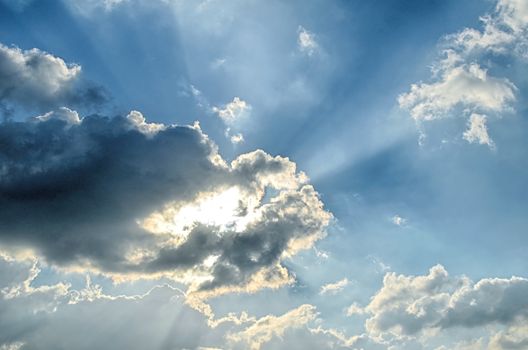 Blue sky with white cloud and sun