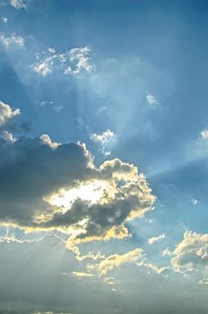 Blue sky with white cloud and sun