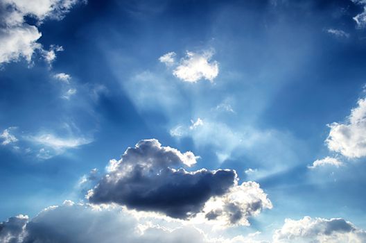 Blue sky with white cloud and sun