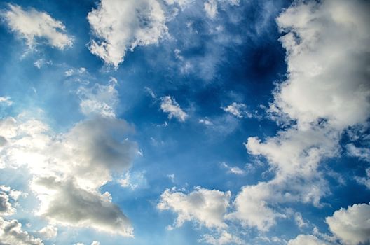 Blue sky with white cloud and sun