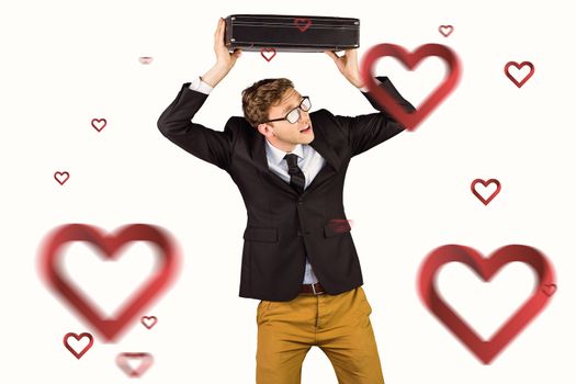 Young geeky businessman holding briefcase against hearts