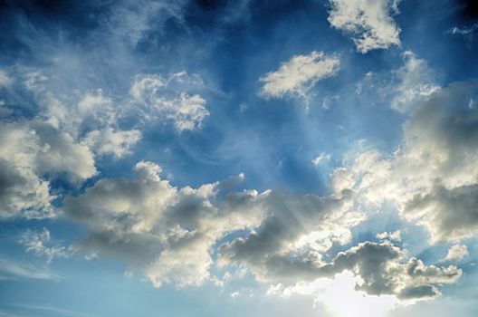 Blue sky with white cloud and sun