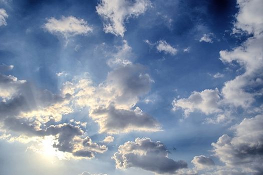 Blue sky with white cloud and sun
