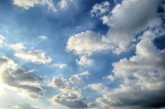Blue sky with white cloud and sun