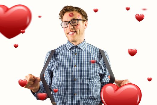 Geeky hipster covered in kisses against hearts