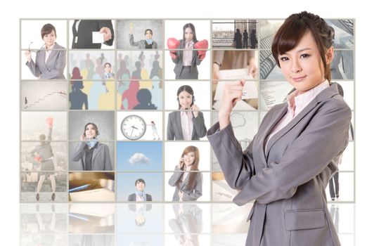 Attractive Asian business woman standing in front of TV screen wall, closeup portrait.