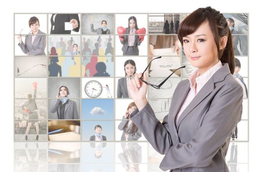 Attractive Asian business woman standing in front of TV screen wall, closeup portrait.