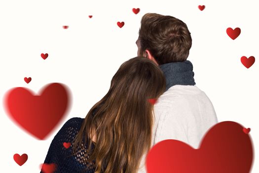 Close up rear view of romantic couple against hearts