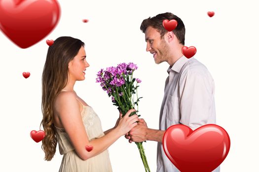 Side view of couple holding flowers against hearts