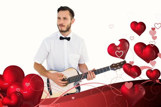 Geeky hipster playing the guitar  against valentines heart design