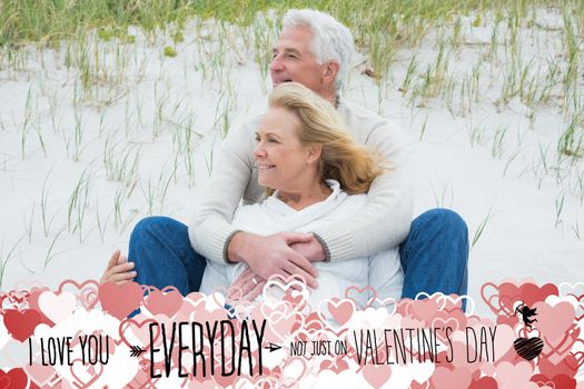 Romantic senior couple relaxing at beach against i love you everyday