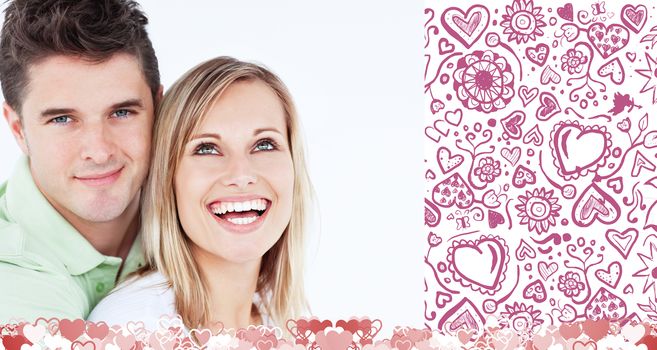 Young beautiful couple man looking at the camera against valentines pattern