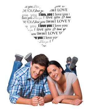 Young couple lying on floor smiling against valentines day pattern