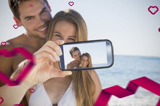 Composite image of valentines couple taking a selfie