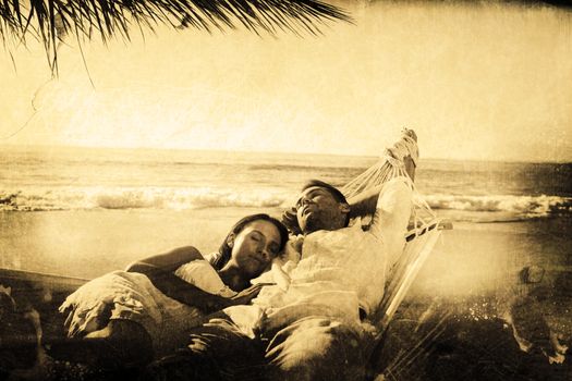 Calm couple napping in a hammock against grey background