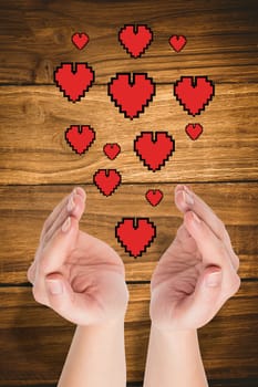 Hands presenting  against wooden table