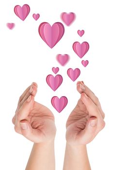 Hands presenting  against heart