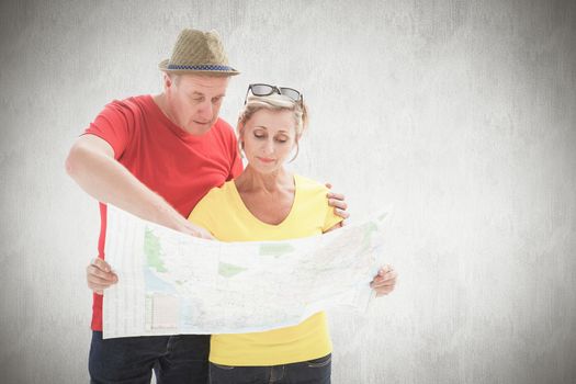 Lost tourist couple using map against white background